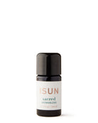 A black bottle with a white label that has the brand name 'ISUN' and the product name 'SACRED Aromablend'. The background is white and clean.